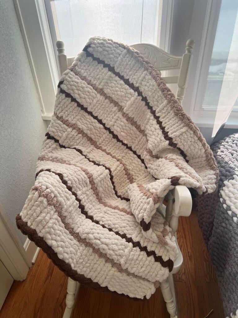 subtle stripe blanket hand knitted in milwaukee wisconsin